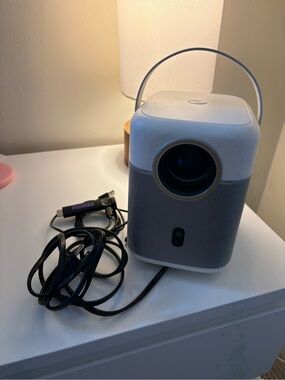 Portable White Projector with Roku Streaming Dongle
